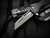 Heretic Knives Jinn Button Lock Flipper Black Aluminum body w/ Magnacut Battleworn Plain Edge Blade (3") H213-5A
