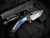 Heretic Knives Custom Medusa Manual Folder Entropic Anodized Titanium Inlaid Carbon Fiber Body w/ Elmax Hand Ground DLC Tanto Plain Edge Blade (3")