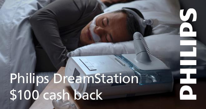 Philips Respironics Philips DreamStation Auto CPAP (hum version) with $100 cash back, woman sleeping peacefully with the device on her bedside table.