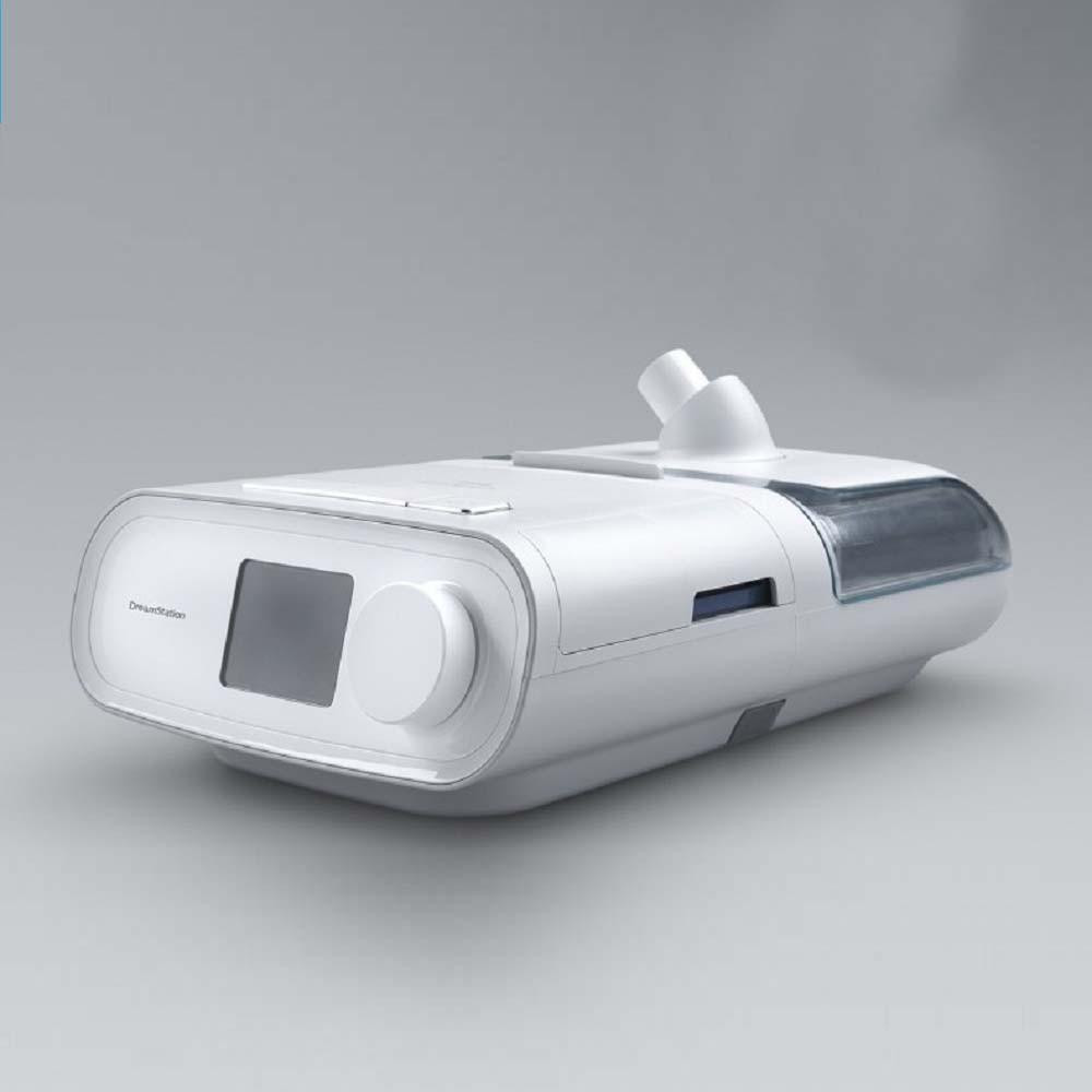 Philips Respironics Dreamstation BIPAP Auto (humidifier version), medical ventilator device for sleep apnea therapy with display screen and adjustable controls.