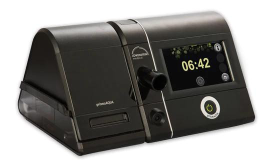 Lowenstein Prisma 20A with heated tube and humidifier, medical ventilator device with digital display and control knob.