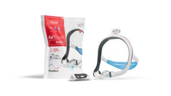 Resmed Airtouch N30i Small Frame, image showing the mask, tubing, and packaging for the sleep apnea therapy device.
