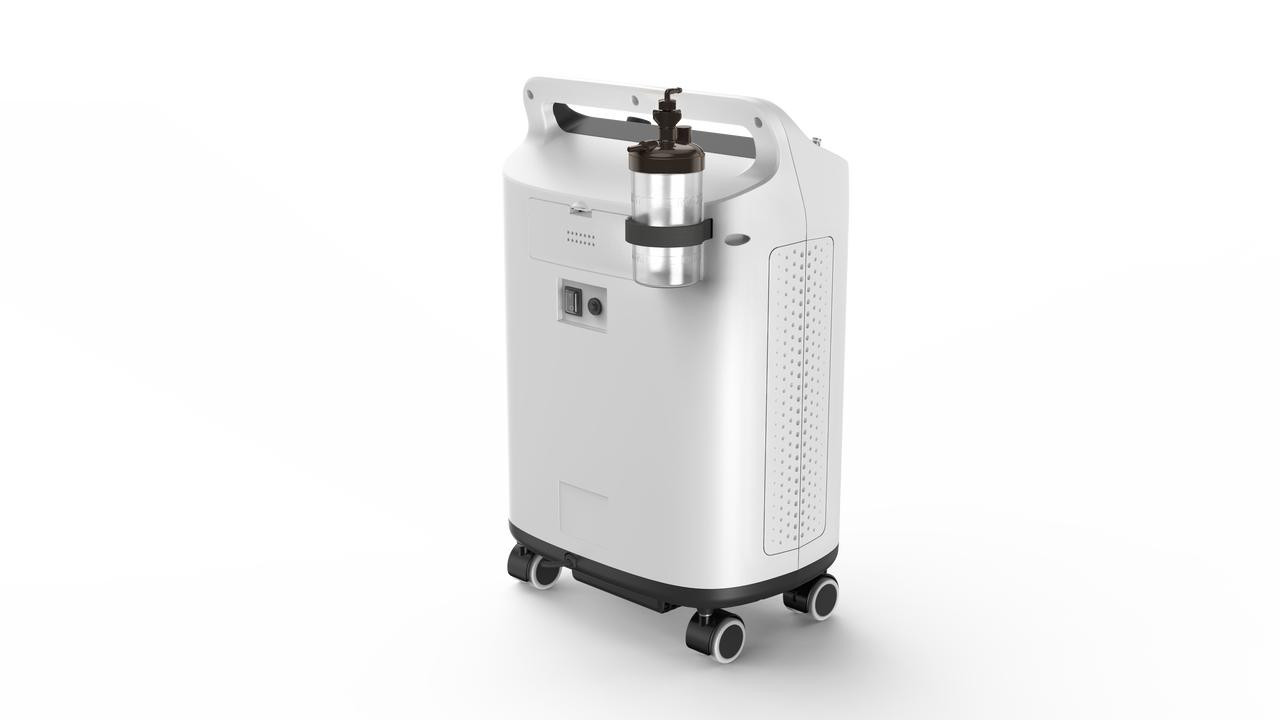 BMC MBC SO1 5B Oxygen Concentrator, white medical device with a compact design on wheels, featuring a control panel and a clear oxygen outlet, used for medical oxygen therapy.