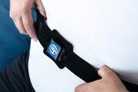 B Medical Nightshift belt Strap, close-up image of a black strap with a digital clip on a person's waist.