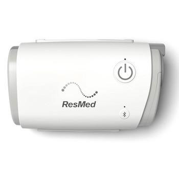 Resmed ResMed AirMini Travel CPAP Machine, compact white portable device with power button and Bluetooth indicator.