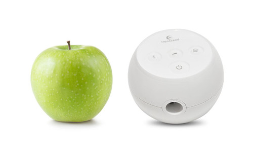 Transcend Micro Auto, a white spherical device with control buttons, placed next to a green apple on a white background.