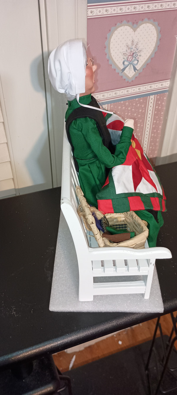 BYERS CHOICE CAROLER-2025- AMISH GRANDMOTHER ON BENCH-NEW