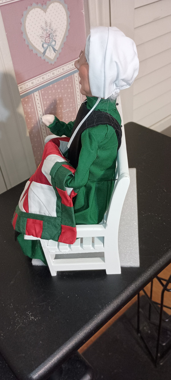 BYERS CHOICE CAROLER-2025- AMISH GRANDMOTHER ON BENCH-NEW