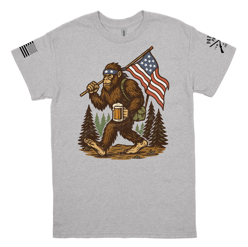 Patriot Pride Men's 4th of July Sasquatch Hiking T-Shirt - Funny American Bigfoot with Beer and USA Flag - Short Sleeve Tee Patriot Pride Men's 4th of July Sasquatch Hiking T-Shirt - Funny American Bigfoot with Beer and USA Flag - Short Sleeve Tee