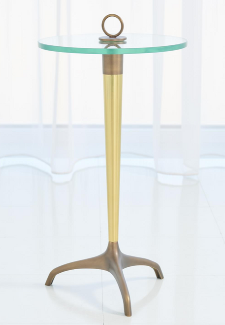 A simple, small scale table with a hoop ring on top to make moving the table into various situations easy. Made from solid brass with combination brass and bronze finishes. The tripod base in contrasting finish is an intentional design detail.