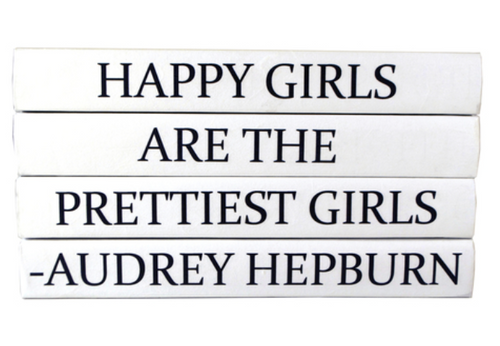 "Happy Girls are the Prettiest Girls" quote on decorative hardbound/repurposed books.