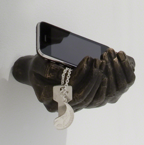 Hand sculptures are made of cast iron, with a bronze power coat finish. They are great as wall sculptures or functional hangers.