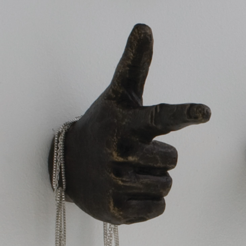 Hand sculptures are made of cast iron, with a bronze power coat finish. They are great as wall sculptures or functional hangers.