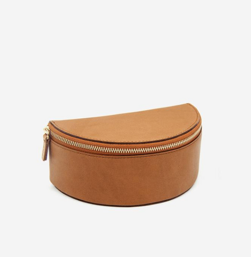 The stylish and safe storage your jewels deserve. Gorgeous full grain leather, double walled for extra stability, zipped into a minimal half-moon shape. Contains a removable leather insert to organize necklaces, rings, and four pairs of earrings. Ideal for travel and for keeping your collection safe and uncluttered at home.
