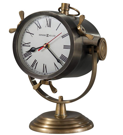 This handsome metal spotlight-style mantel clock features an antique nickel finished case which is suspended in an antique brass finished bracket and base and includes antique brass finished accents.