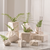 These watertight vases are made of ceramic to resemble cut stone blocks. They can be stacked, clustered, massed out or used individually. Use them for buds, twigs, or greenery; they also add texture and form as sculptural pieces.