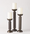 These towering candlesticks are made from hand hammered, bronze plated iron sheet. Each holds a 4 inch pillar candle