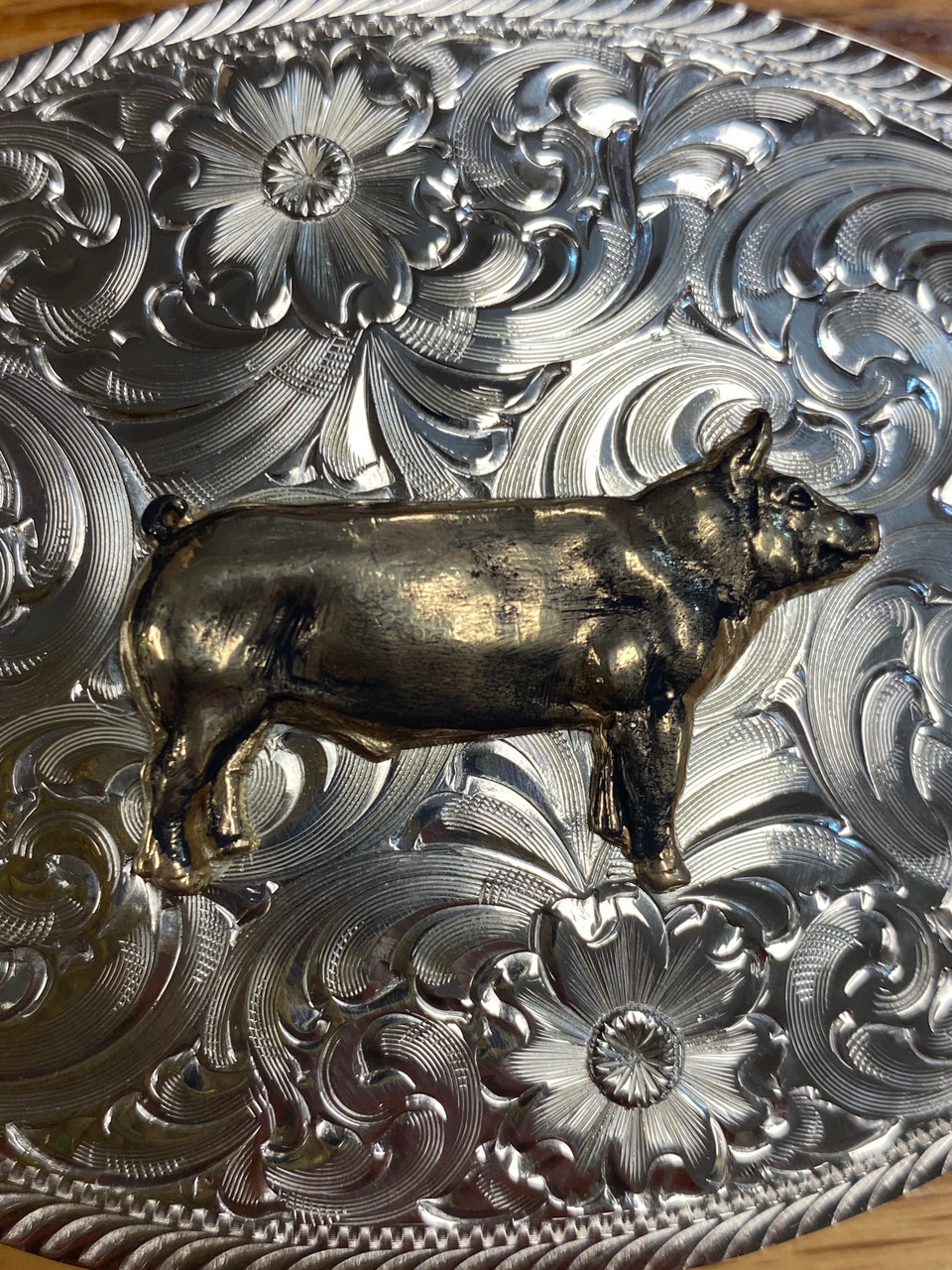 Pig shop belt buckle