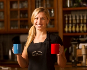 Woman holding cups of coffee
