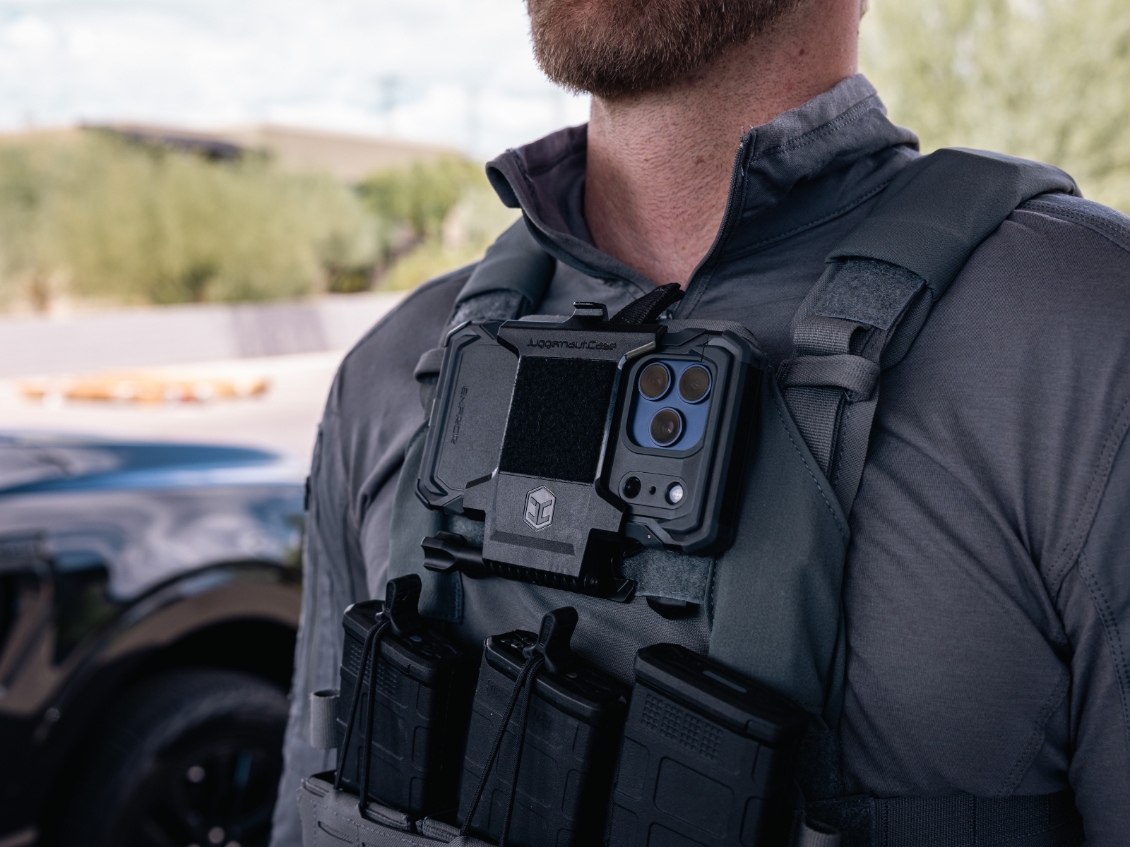 Juggernaut.Case iPhone 17 case mounted to tactical gear