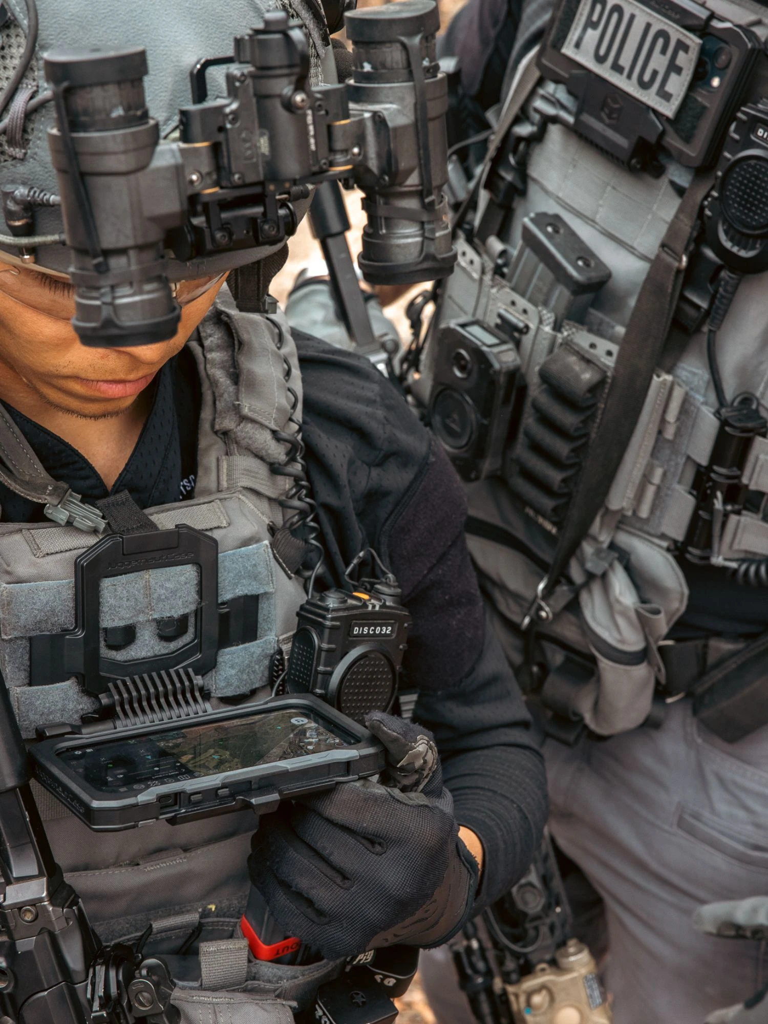 Law enforcement personnel using rugged mobile equipment