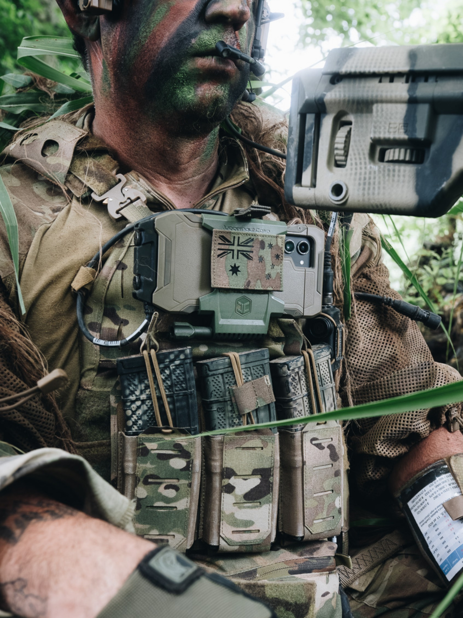 Military personnel using rugged mobile equipment