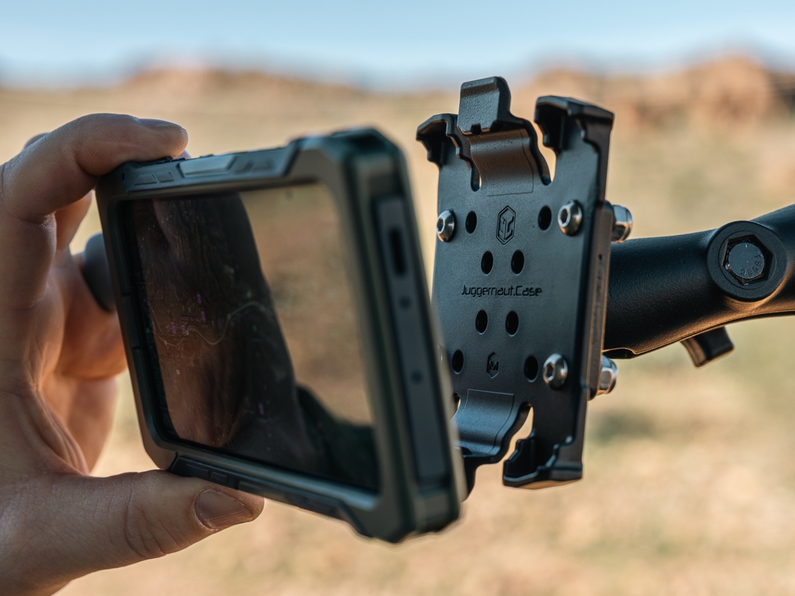 Mobile device secured in a Juggernaut.Case Vehicle Mount