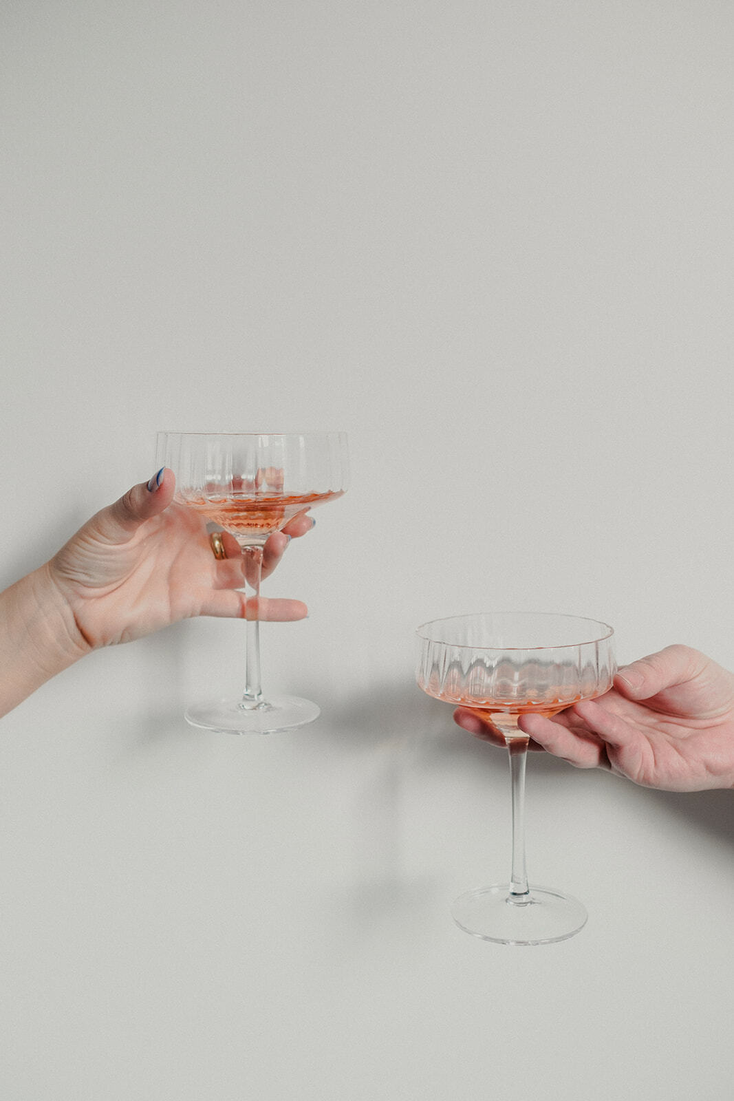 Two glasses of wine toasting