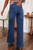 A stylish woman wearing high-waisted wide leg denim jeans featuring front patch pockets and a flattering fit. These trendy blue jeans offer a relaxed silhouette, perfect for casual outfits, everyday wear, or chic street style looks. Easy to pair with tops and sneakers for a modern, effortless outfit. Available at LuxeUp.

? KEYWORDS (optional)

wide leg jeans women, patch pocket jeans, high waisted denim jeans, trendy jeans women, casual denim outfit, blue jeans women, street style jeans, relaxed fit jeans, modern denim fashion.