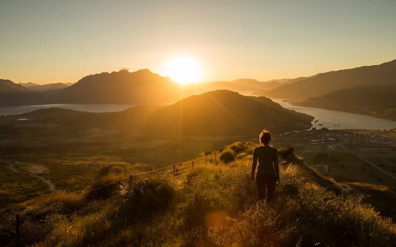 Country sunset with person looking out