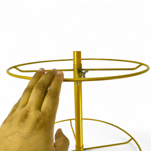 4 Tier Rotating Golden Metal Display Rack for Jewelry, Socks & Lingerie, product shown against a coloured background