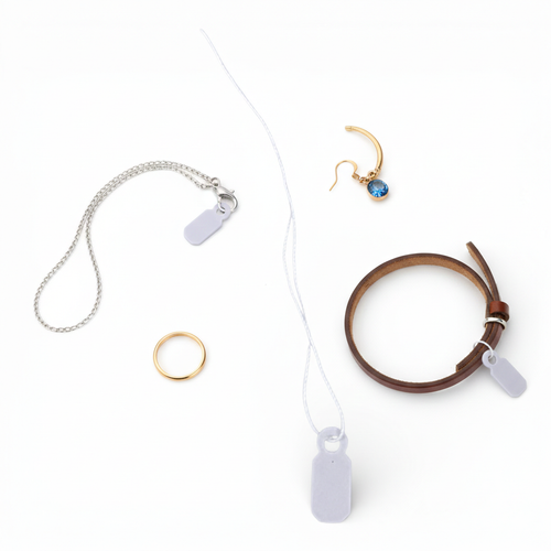 White Strung Parcel Tags with Cotton String, close product view on a white background, tight, centred square layout