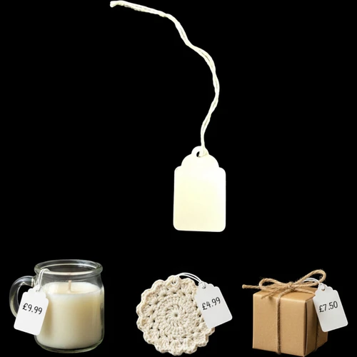 White Strung Parcel Tags with Cotton String, product shown against a dark background