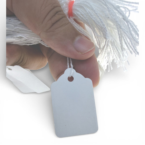 White Strung Parcel Tags with Cotton String, product shown against a coloured background, standard product photograph