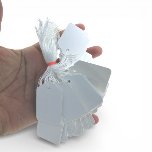 White Strung Parcel Tags with Cotton String, close product view against a light background