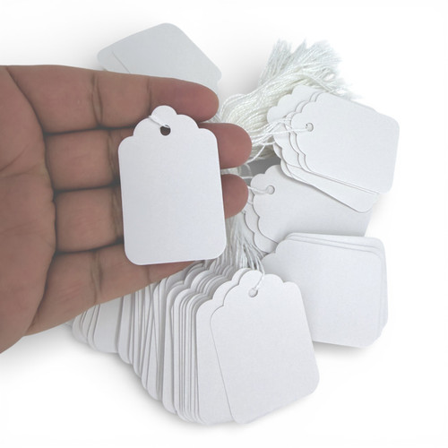 White Strung Parcel Tags with Cotton String, close product view on a white background, tight, centred square layout