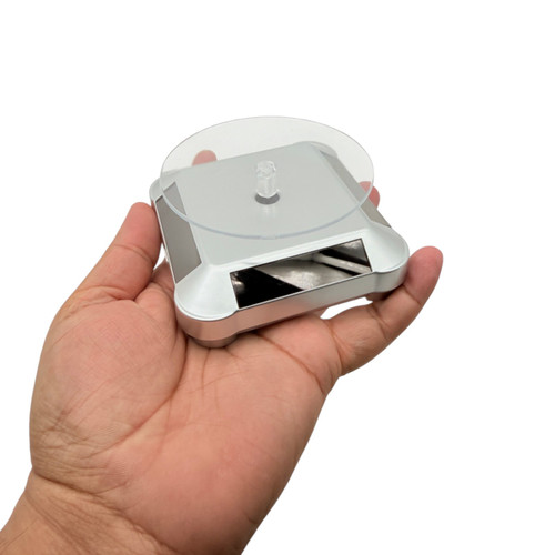 Solar Powered Rotating Display Stand 360° Turntable Silver Round, product shown against a coloured background