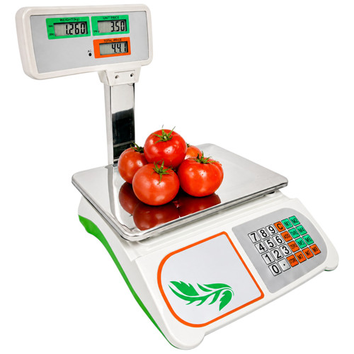 Digital retail price-computing scale with pole display and tomatoes on the platform