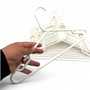 White Heavy Duty 41.5cm Plastic Hangers with Trouser Bar and Shoulder Notches, product shown against a coloured background