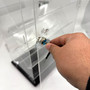 Large Clear Acrylic Rotating Display Cabinet with Lock, product shown against a coloured background