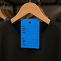 1000 Unstrung Perforated Stock Tickets 41x63mm Blue, Swing Tags for Tagging Guns, close product view against a dark background