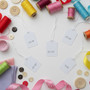 White Strung Parcel Tags with Cotton String, close product view against a coloured background