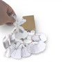 White Strung Parcel Tags with Cotton String, product shown against a coloured background, balanced, centred square layout