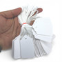 White Strung Parcel Tags with Cotton String, close product view on a white background, close product photograph