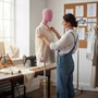 Premium Pink Velvet Female Plastic Torso with Adjustable Height Wooden Stand, product shown against a coloured background, balanced, centred square layout