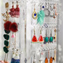 360 Rotating Clear Acrylic Earring Holder 4 Tier Jewellery Display Stand, close product view against a coloured background