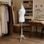 White Female Mannequin Torso with White Wooden Tripod Stand, product shown against a coloured background, standard product photograph