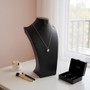 Black Leatherette Necklace Bust Display Stand for Jewellery Shop or Home Use, product shown against a coloured background