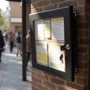 Black Lockable Snap Frame Outdoor Poster Case A1, printed product shown against a dark background