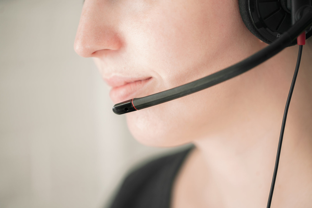 A customer service adviser wearing a headset